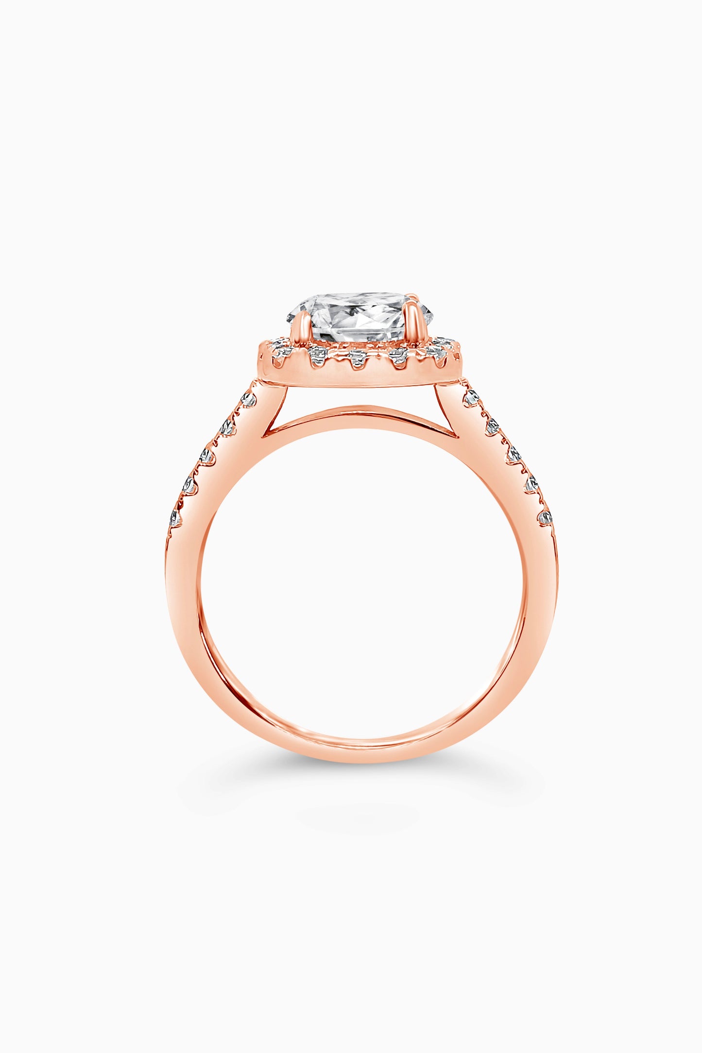 Rose Gold round cut stone surrounded by a Square Halo and Pavé band - Side View