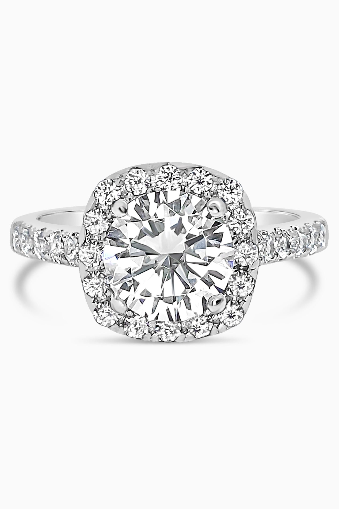 White Gold round cut stone surrounded by a Square Halo and Pavé band