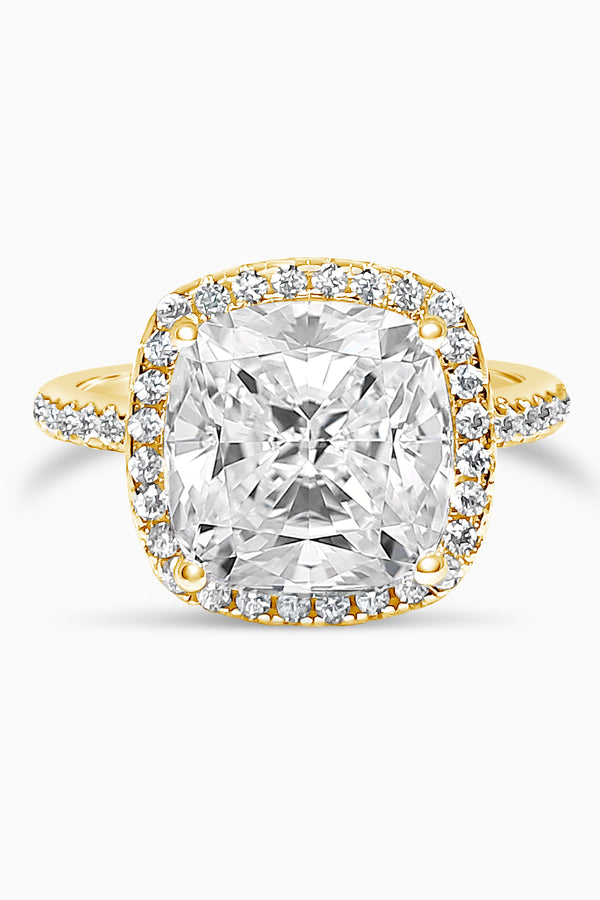 Yellow Gold Large Cushion Cut with Surrounding Halo and Pavé stones all along the prongs, crown, and band