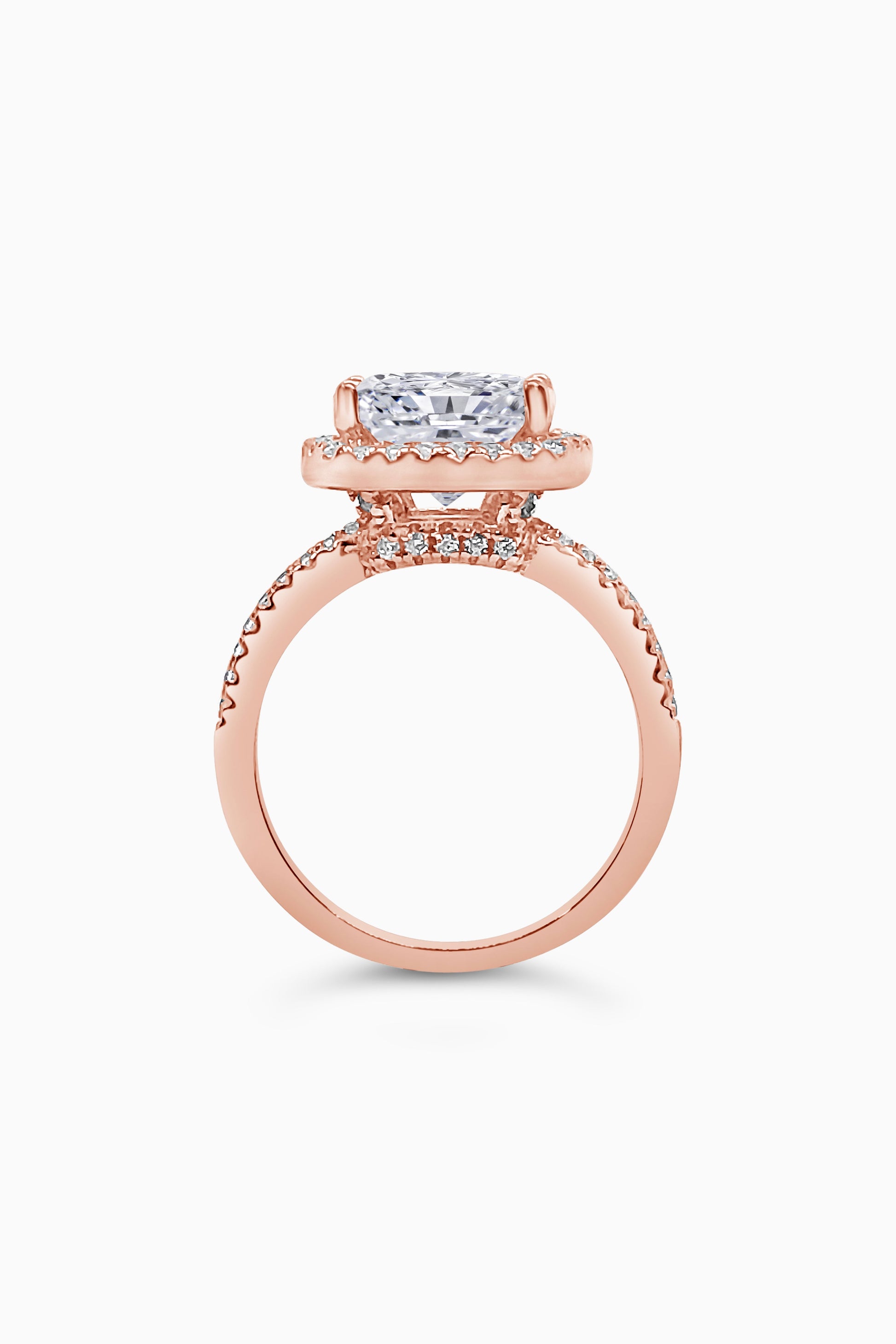 Rose Gold Large Cushion Cut with Surrounding Halo and Pavé stones all along the prongs, crown, and band - Side View
