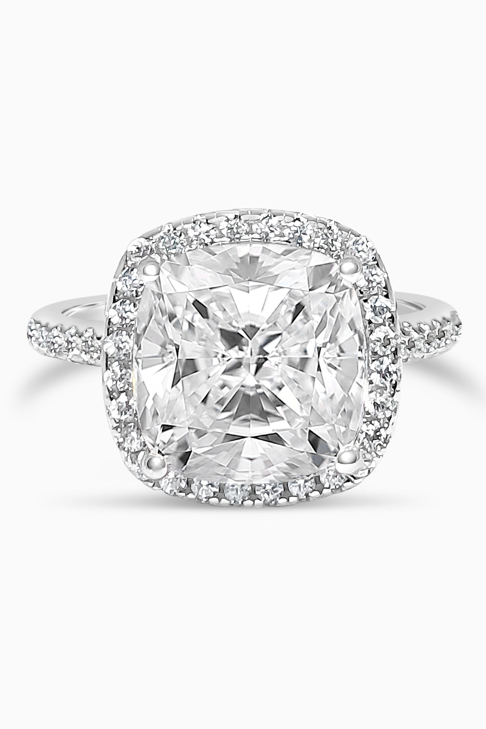 White Gold Large Cushion Cut with Surrounding Halo and Pavé stones all along the prongs, crown, and band