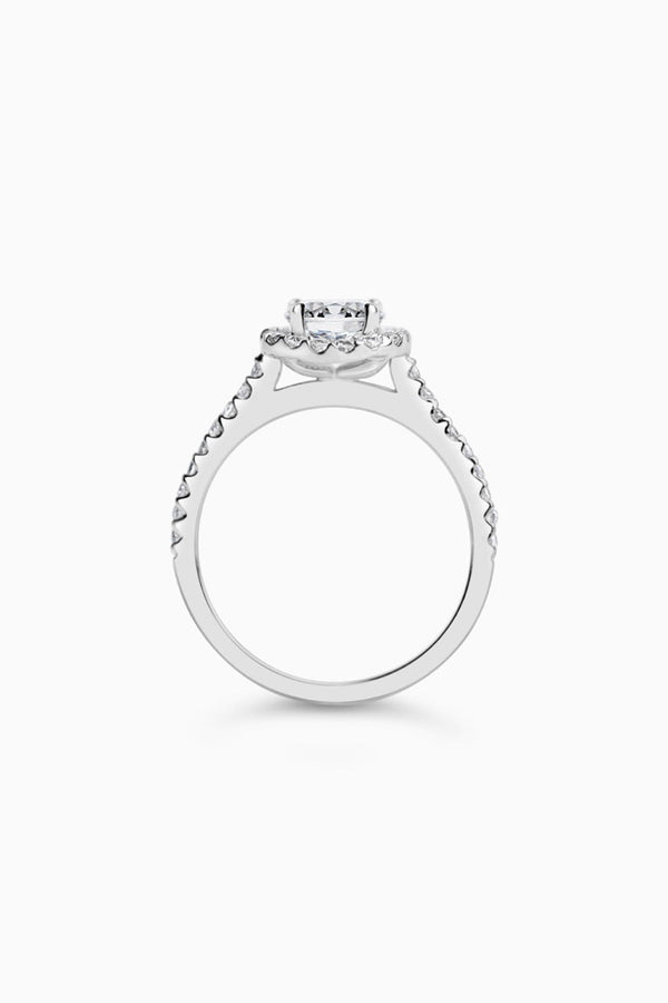 White Gold Round Cut Stone set on a Low Profile Setting with a Halo and Pavé Band - Side View