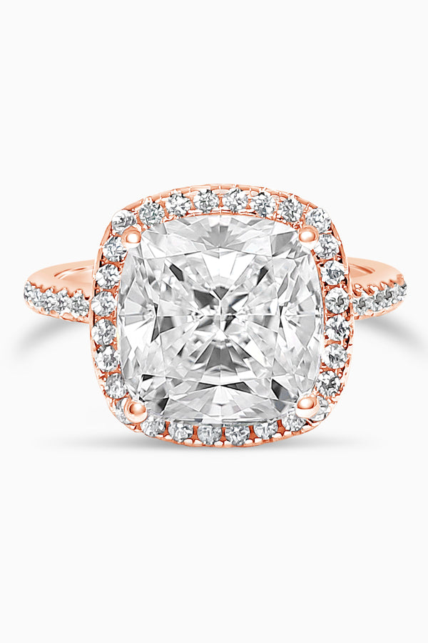 Rose Gold Large Cushion Cut with Surrounding Halo and Pavé stones all along the prongs, crown, and band