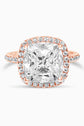 Rose Gold Large Cushion Cut with Surrounding Halo and Pavé stones all along the prongs, crown, and band