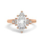 Rose Gold Marquis Cut Engagement Ring Accompanied by Round Stones