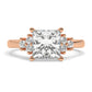 Rose Gold Princess Cut Engagement Ring Accompanied by Round Stones