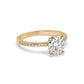 Yellow gold oval diamond set with a hidden halo on a pave setting - rotated view