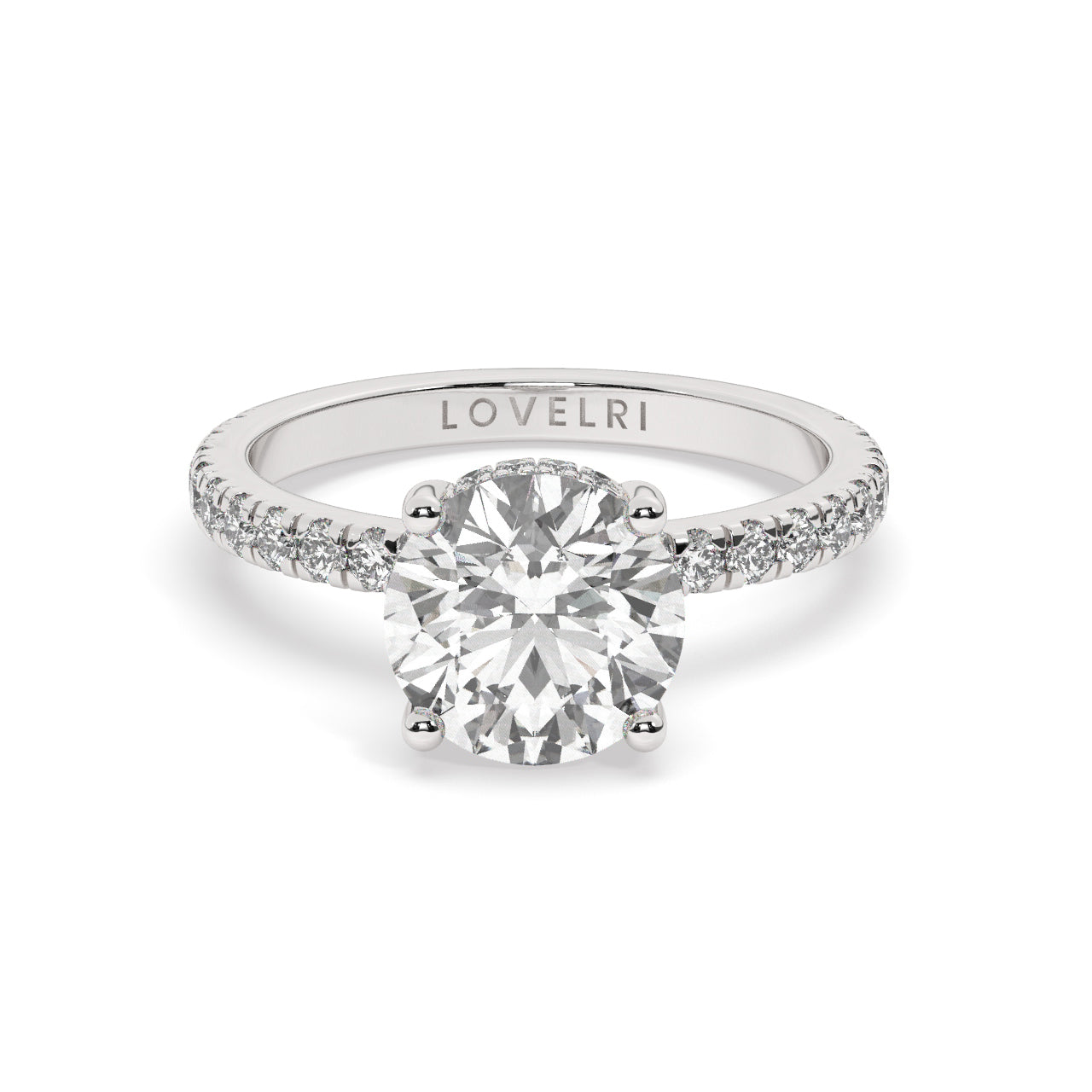 Platinum Round Cut Engagement Ring on a Pavé Band with a Hidden Halo