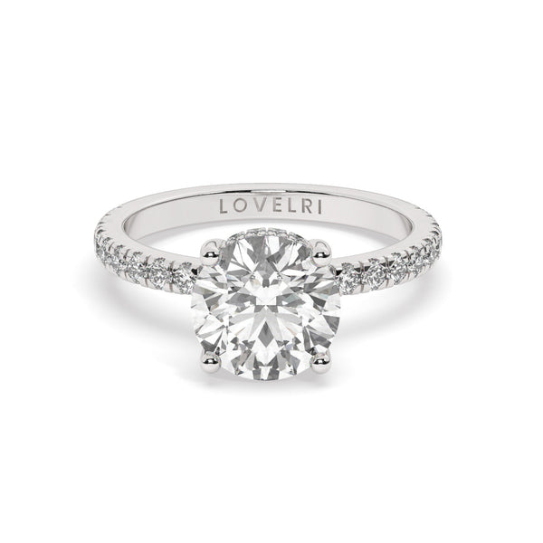 Platinum Round Cut Engagement Ring on a Pavé Band with a Hidden Halo