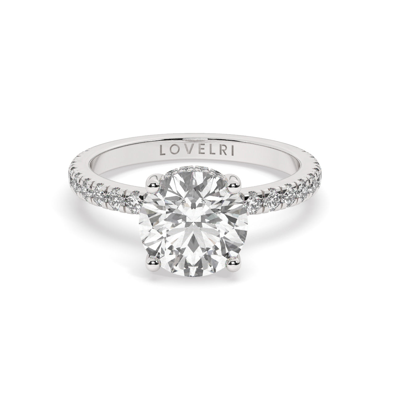 Platinum Round Cut Engagement Ring on a Pav√© Band with a Hidden Halo