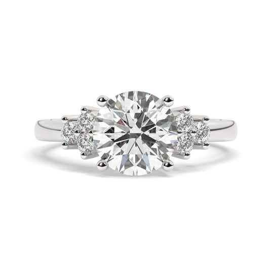 Platinum Round Cut Engagement Ring Accompanied by Round Side Stones