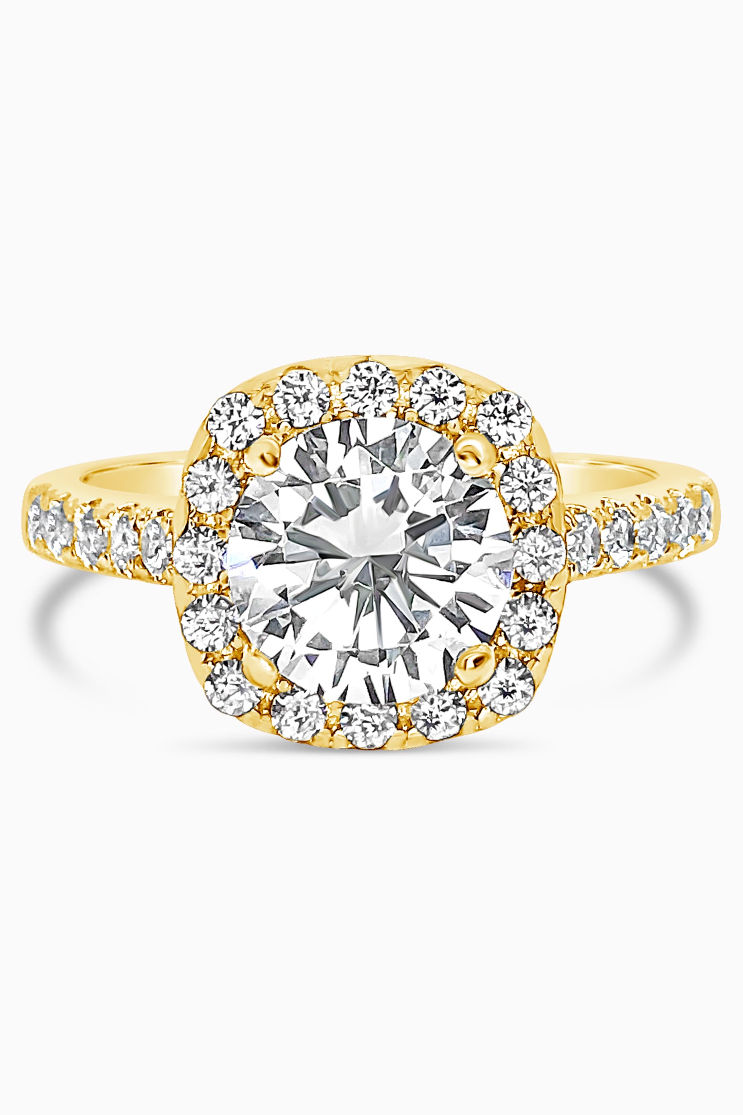 Yellow Gold round cut stone surrounded by a Square Halo and Pavé band