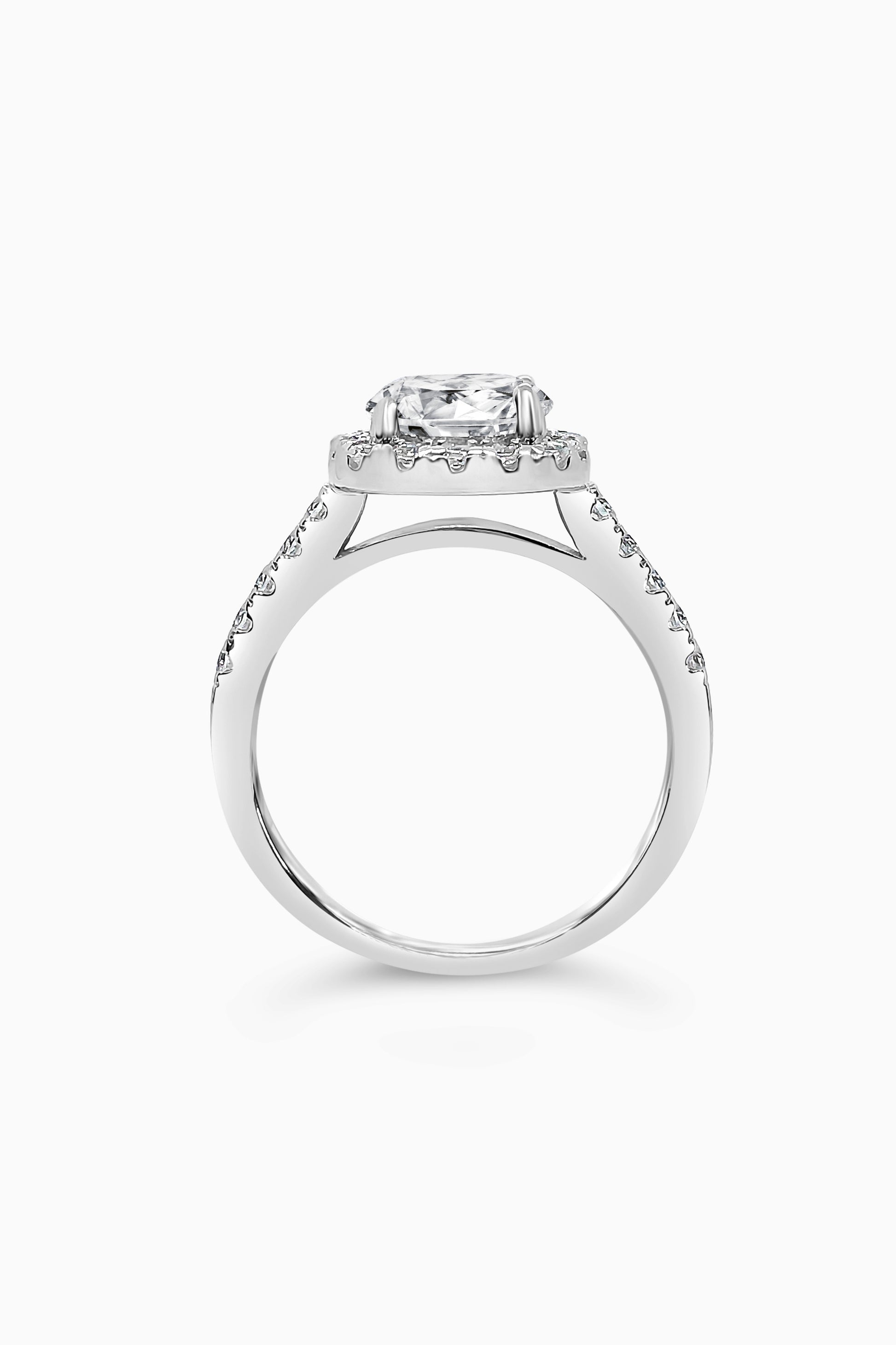 White Gold round cut stone surrounded by a Square Halo and Pavé band - Side View