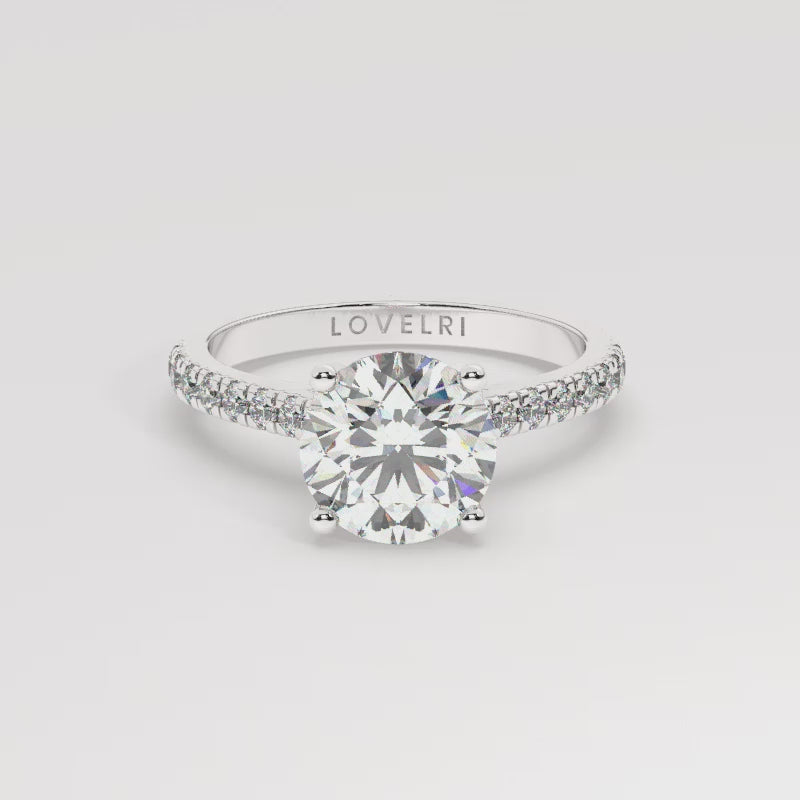 White Gold Round Cut Engagement Ring with a Pavé Band and a Hidden Stone - 360 View